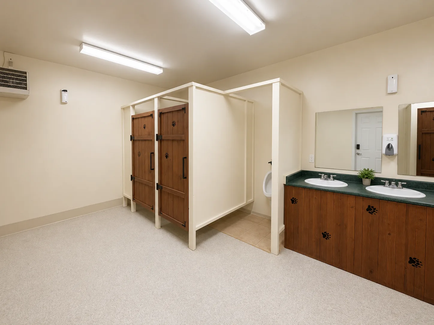 The clean shower and washroom building with paw-print accents